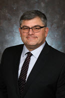 Mr. Paul Holenstein, Executive Vice President