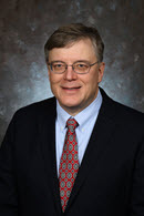 Dr. Bruce Holenstein, President and CEO